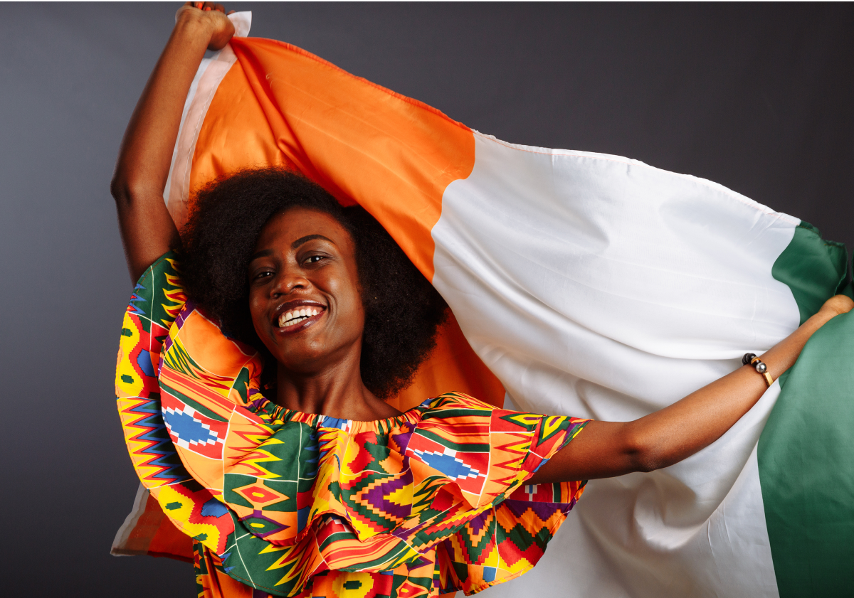 Woman holding the flag of the Ivory Coast