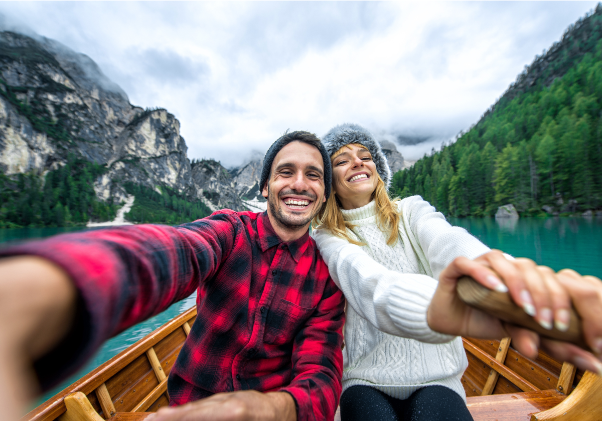 Couple rowing on lake in Finland