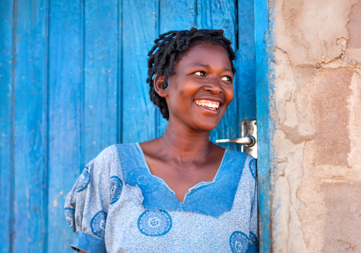 Woman smiling in traditional clothing in Botswana