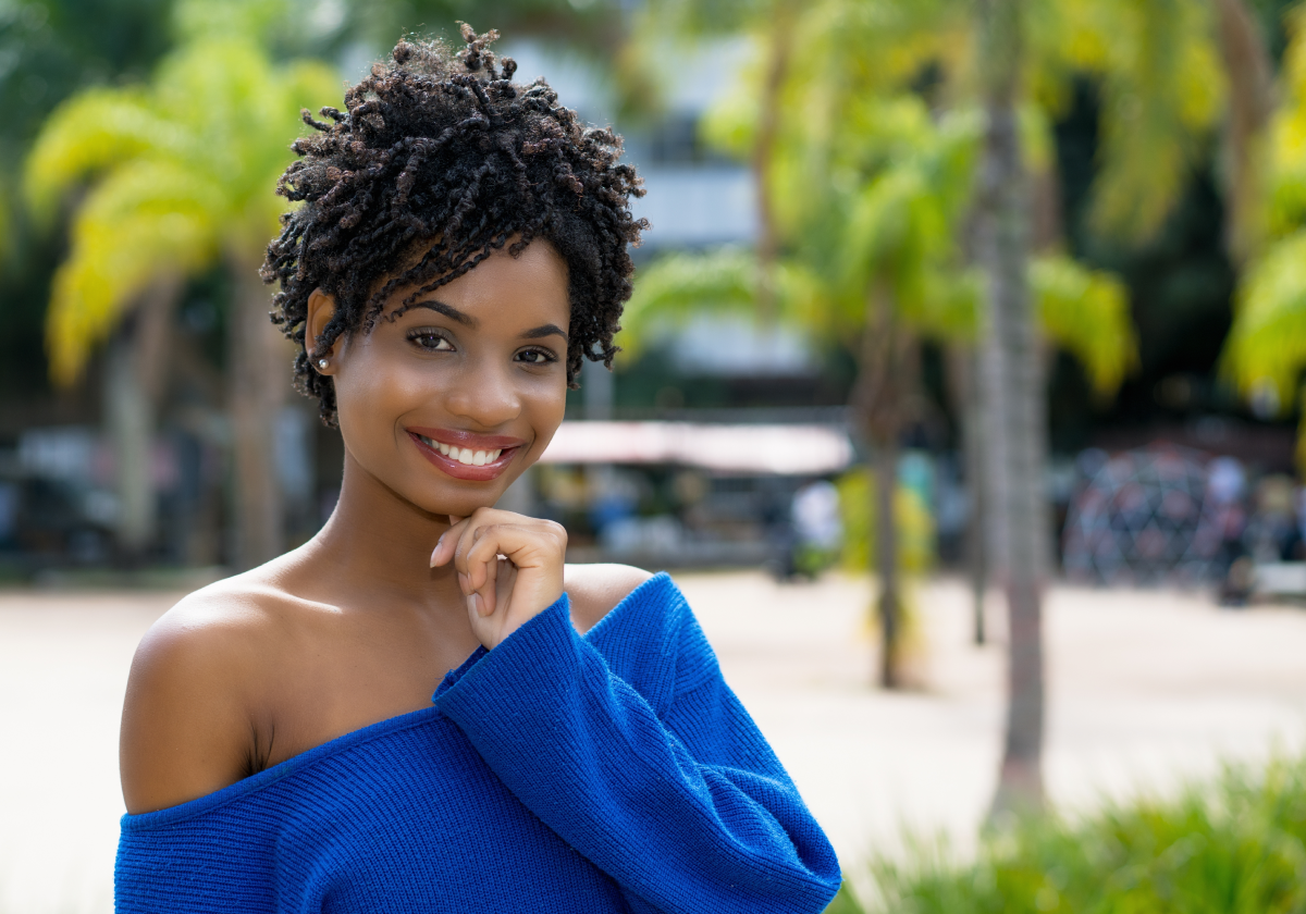Woman smiling in a park in Barbados