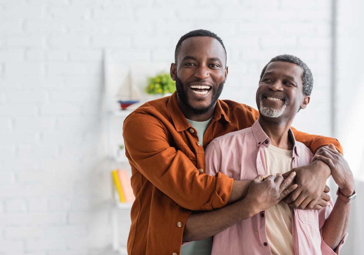 Father and son embracing in Benin