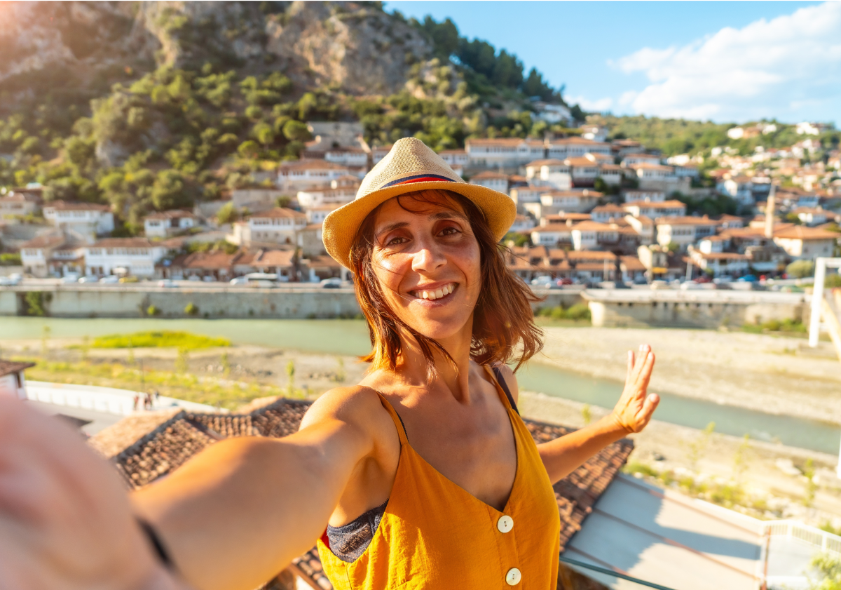 Photo of woman taking a selfie in a town in Kosovo