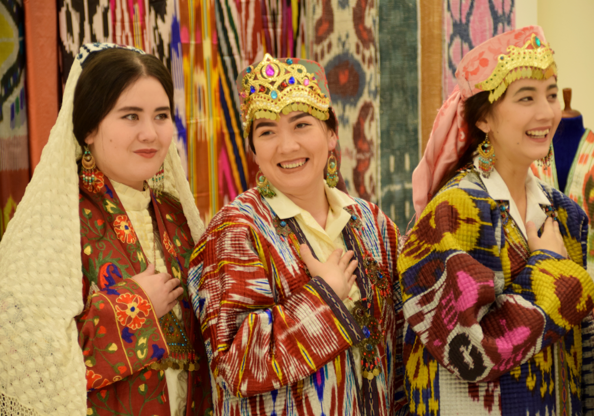 Photo of three women from Uzbekistan wearing traditional clothing
