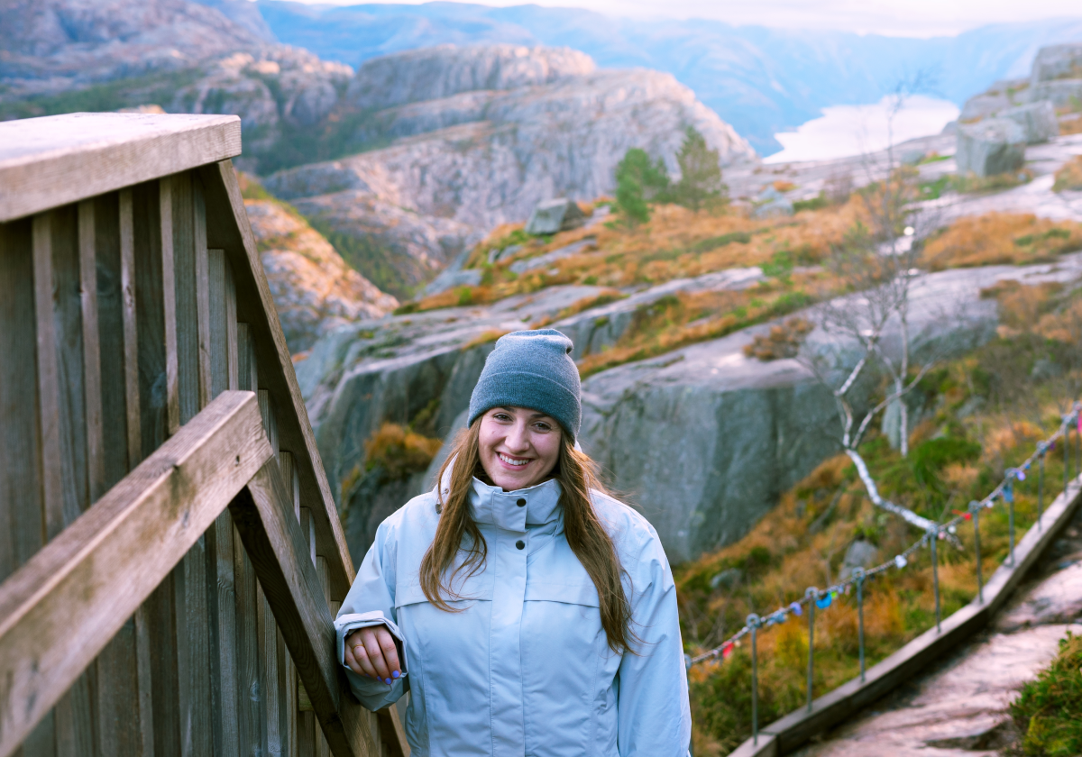 Photo of woman hiking in mountains of Norway