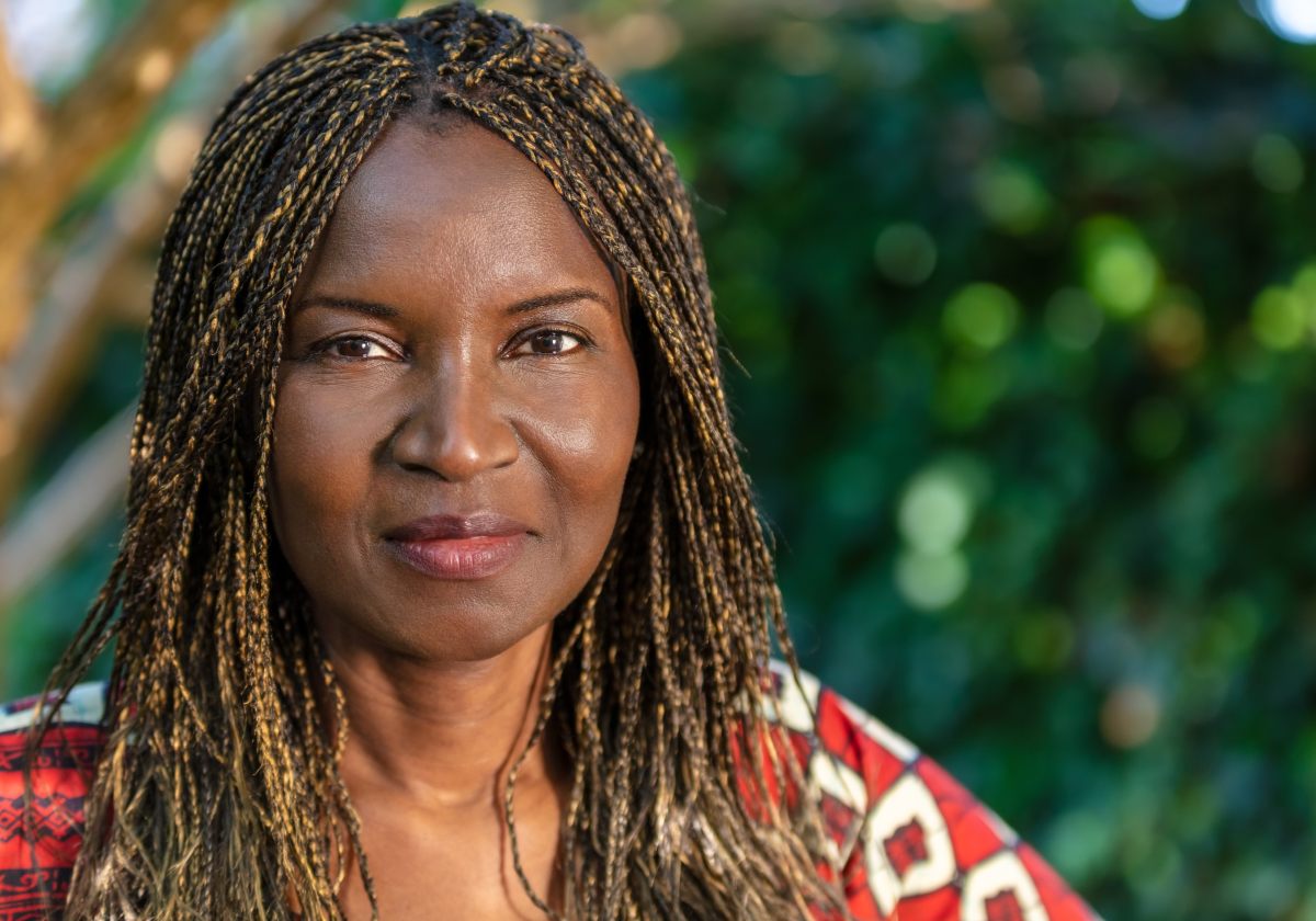 Woman smiling wearing traditional clothing in Chad