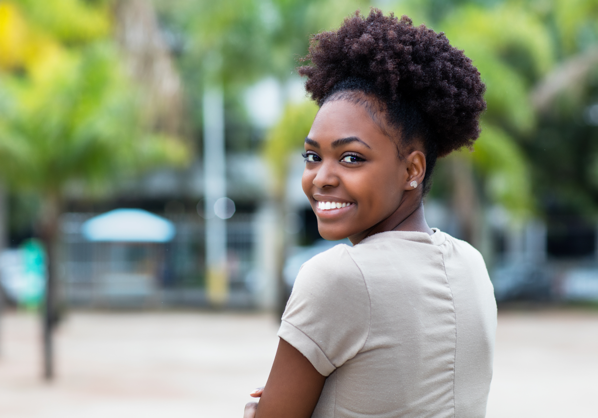 Woman smiling in a park in the Bahamas