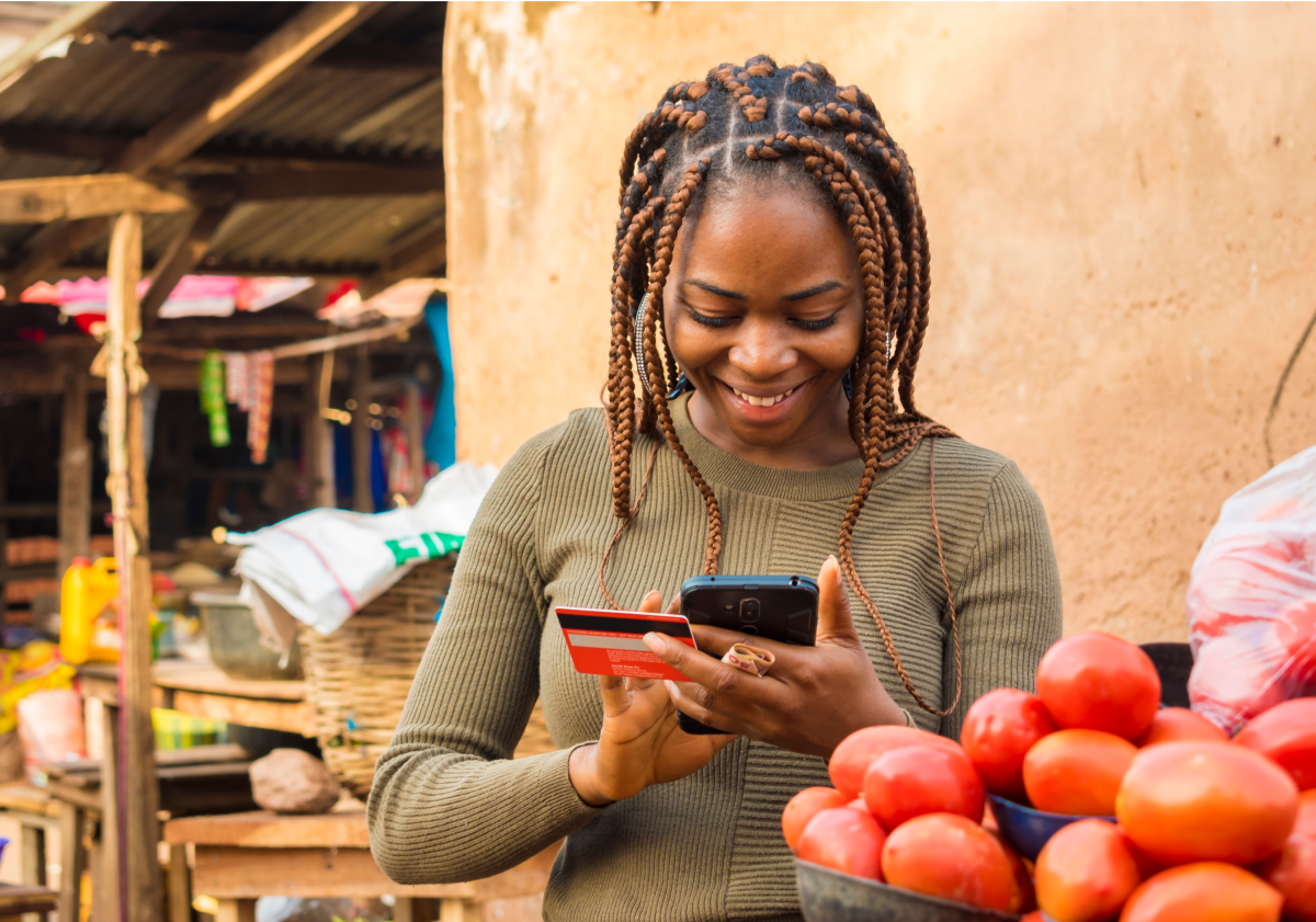 Photo of woman on cell phone in a city in Nigeria