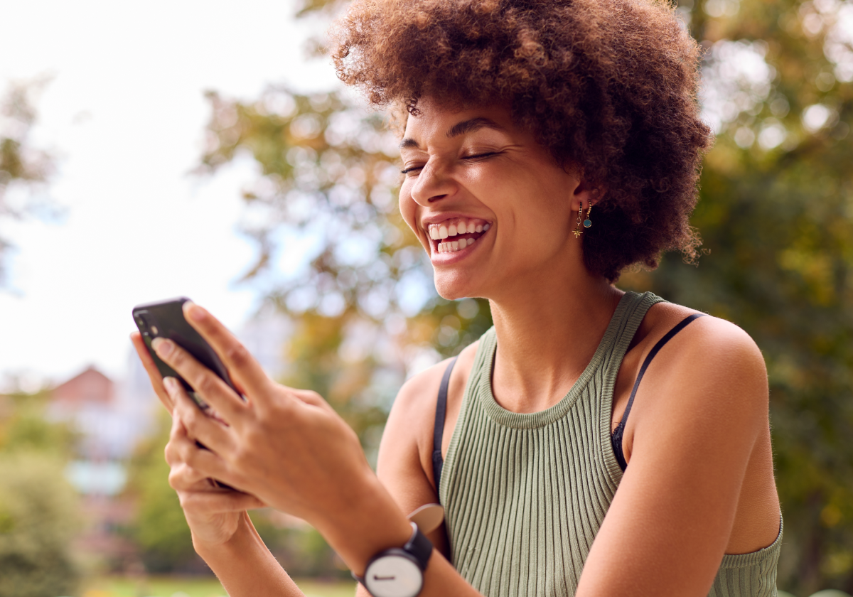Smiling woman on cell phone in Bonaire, St. Eustatius, and Saba