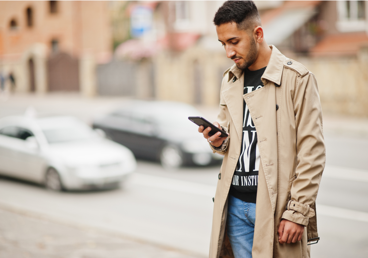 Photo of man on a cell phone in a city in Lebanon