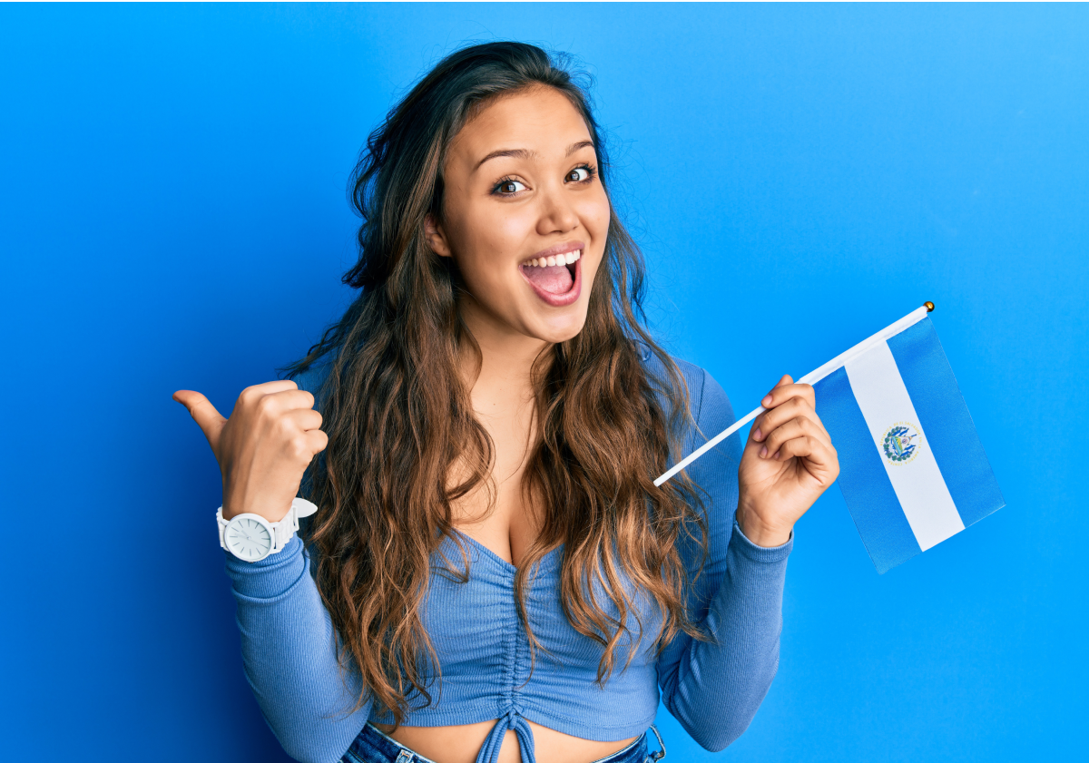 Woman holding flag in El Salvador