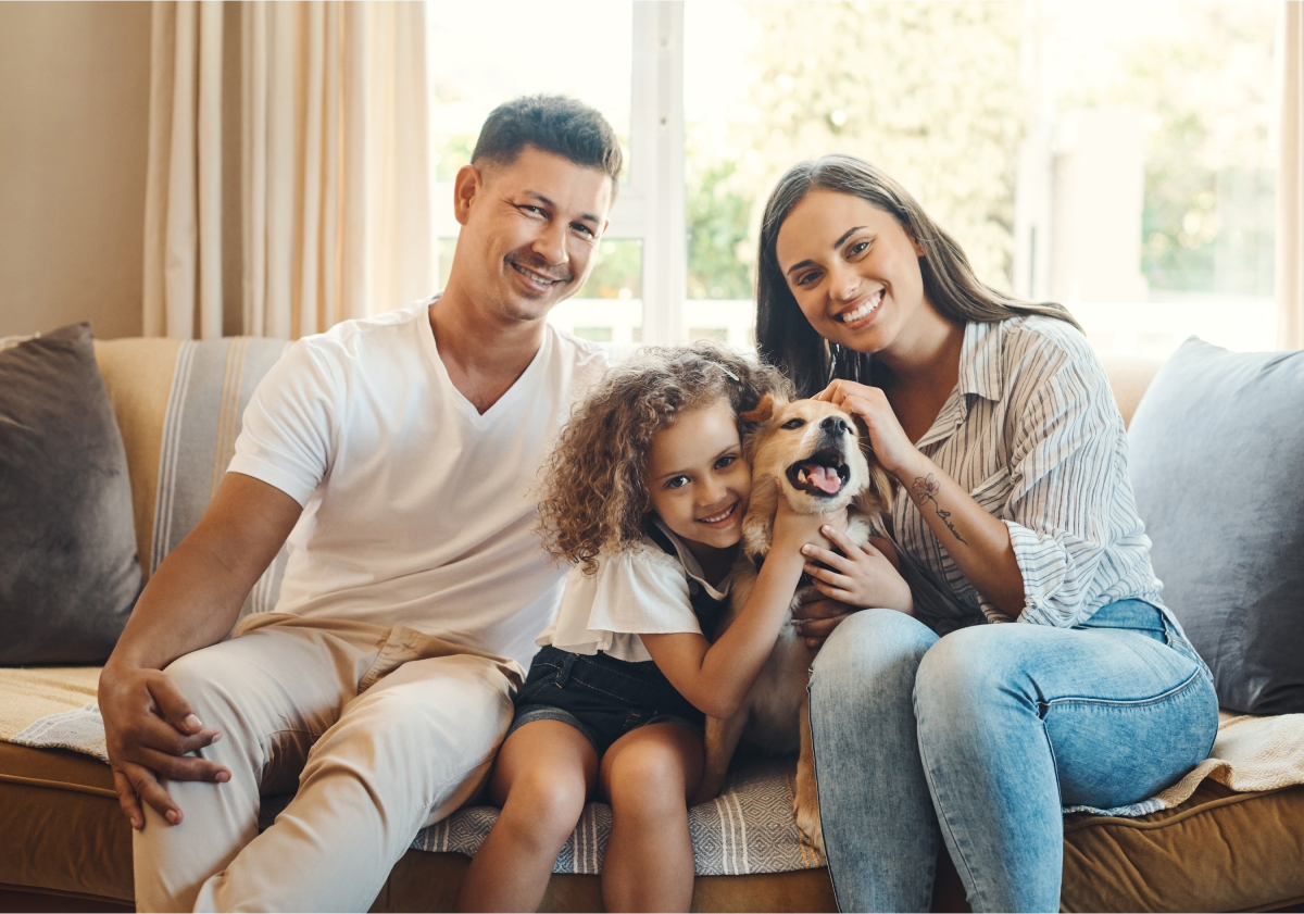 Photo of family on couch with a dog in Austria