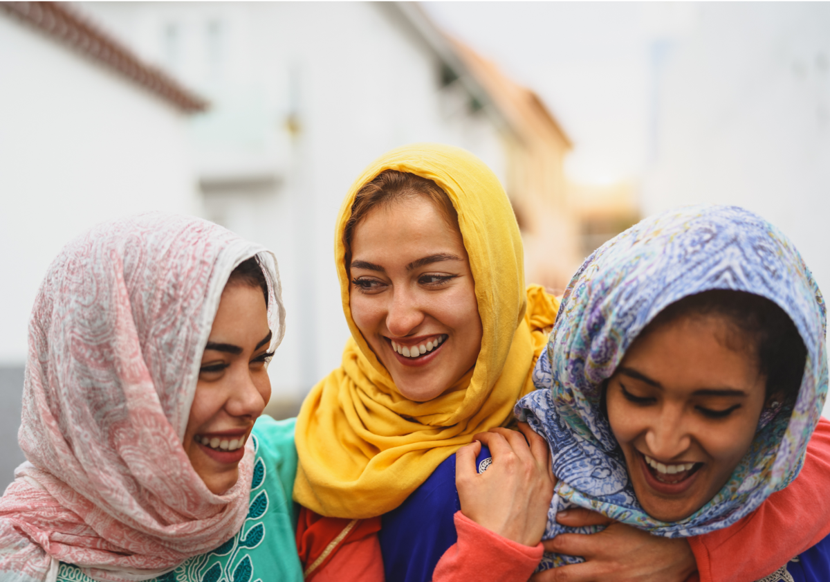 3 woman laughing in city in Egypt