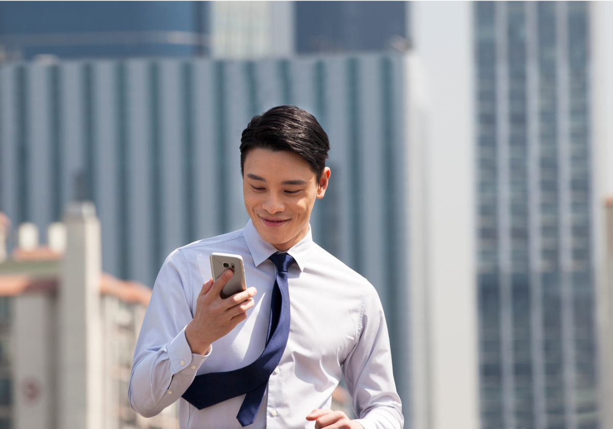 Photo of man using cell phone in Singapore